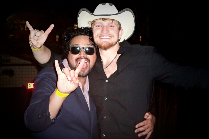 TKE brother in western wear at a chapter event
