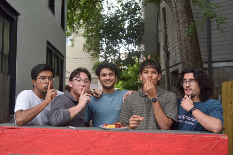 TKE brothers at an outdoor crawfish boil event